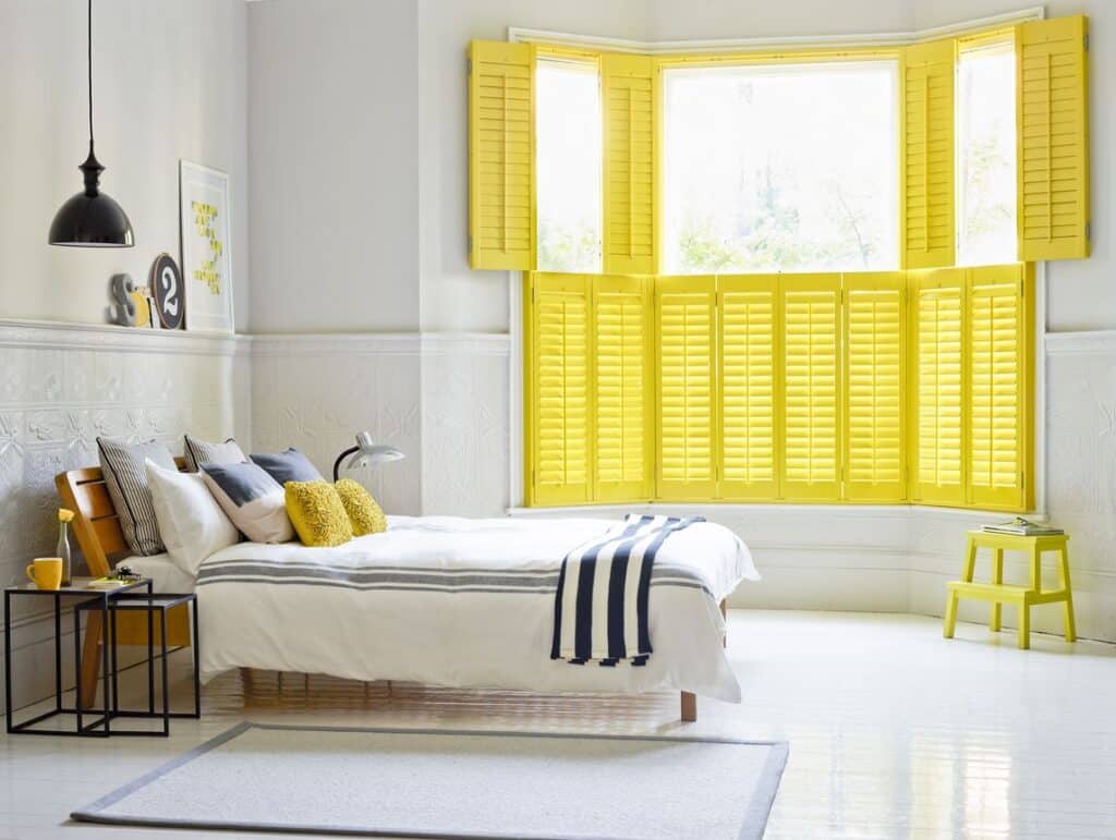 Yellow bedroom bay window shutter hybrawood top open